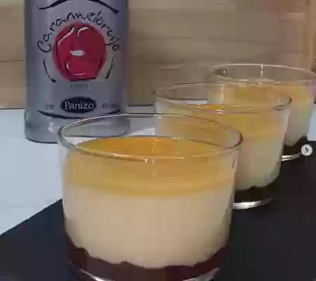 Crema de arroz con leche con sabayón de Caramelorujo y coulis de frambuesa